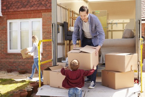 Moving team handling office relocation logistics on a residential London street