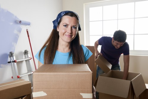 Professional moving team loading furniture with precision and care