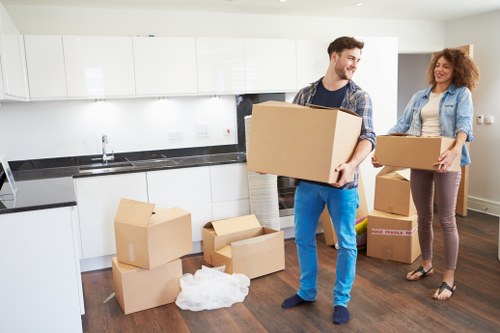 Moving van and packed boxes outside a Belsize Park apartment building