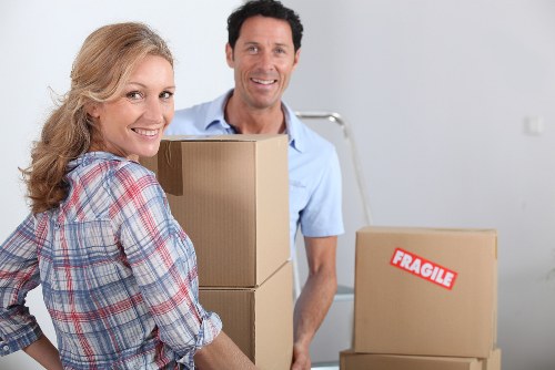 Moving boxes and furniture being loaded for a home relocation in Belsize Park