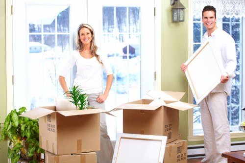 Packing and preparing items for a moving truck in Belsize Park
