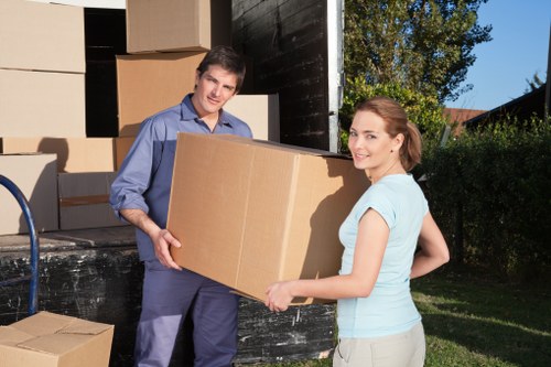 Professional removals team handling furniture and boxes on short notice